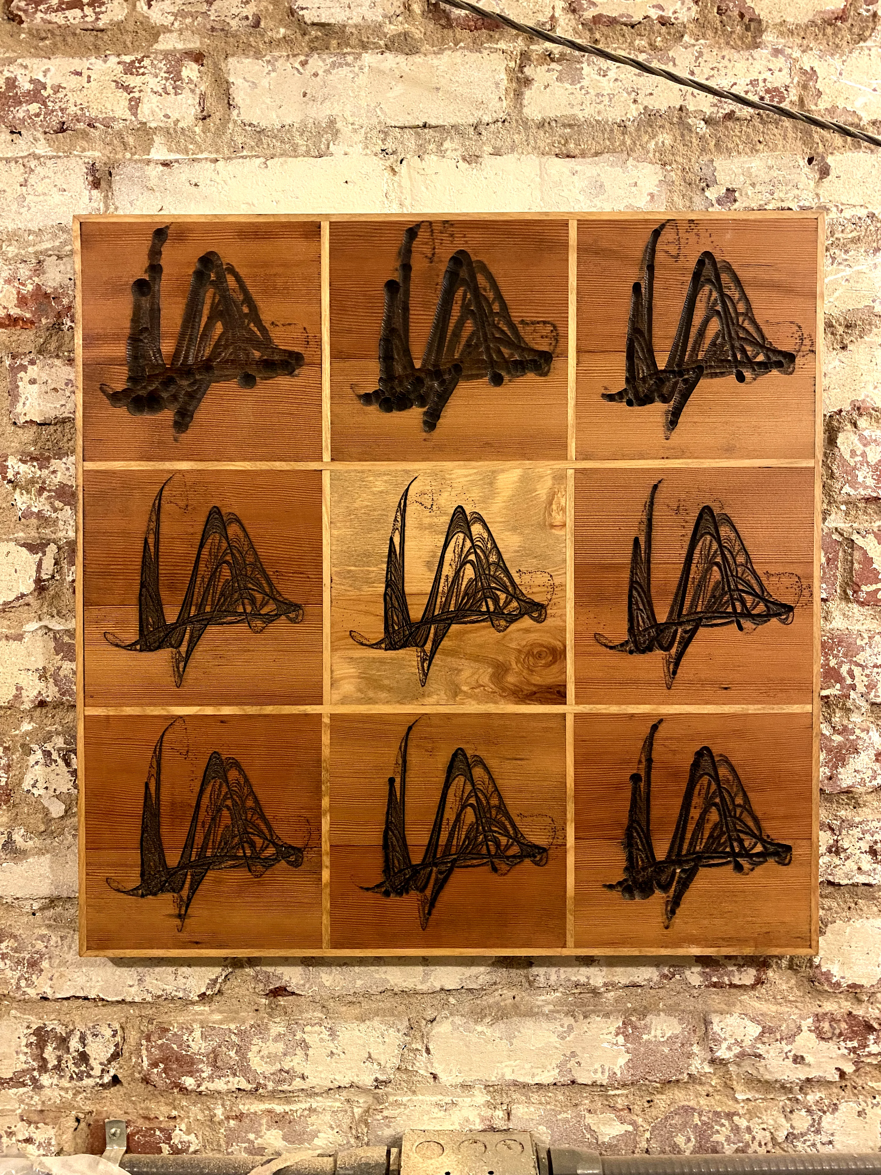 Nine-panel carved grid in cedar and fir