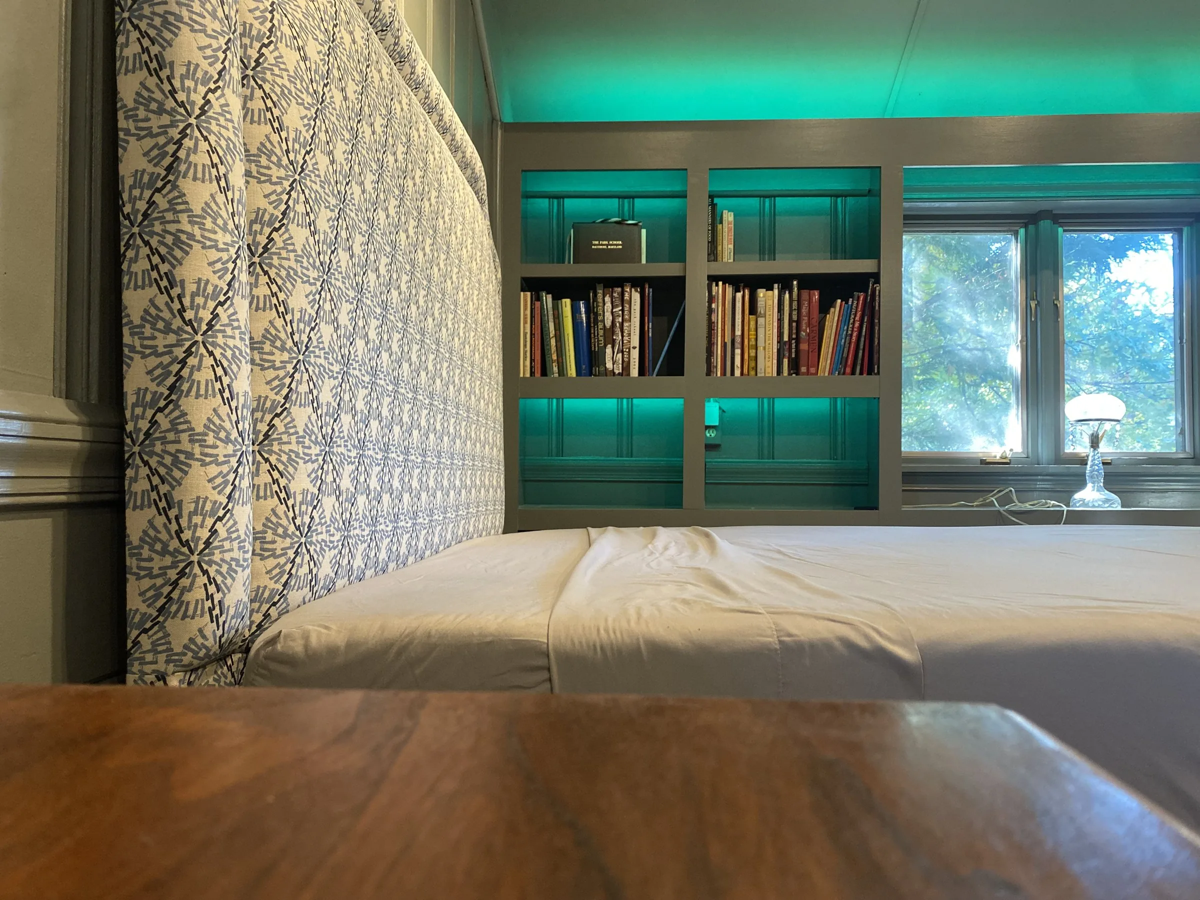 Lit guest-room bookshelves