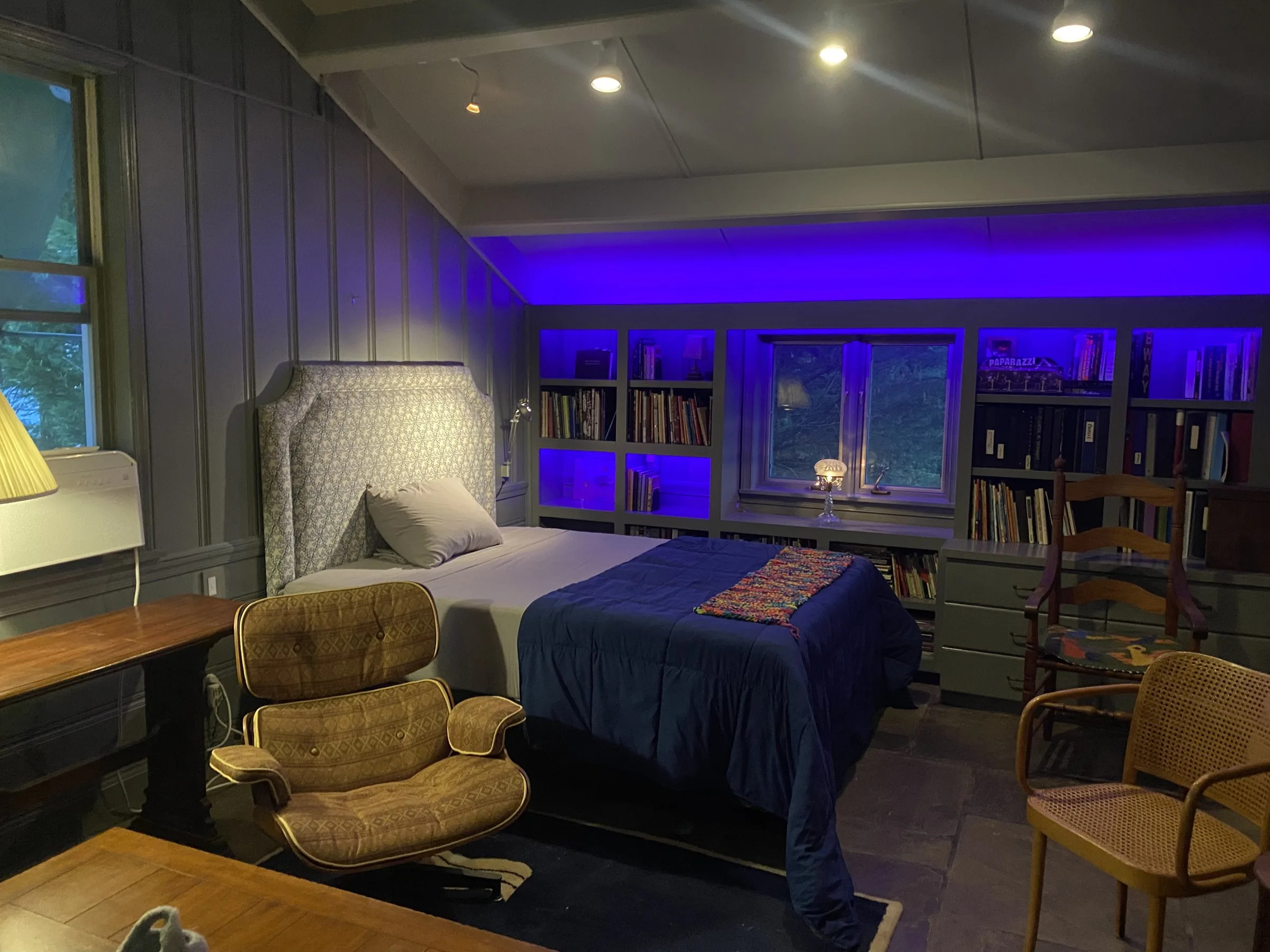 Lit guest-room bookshelves