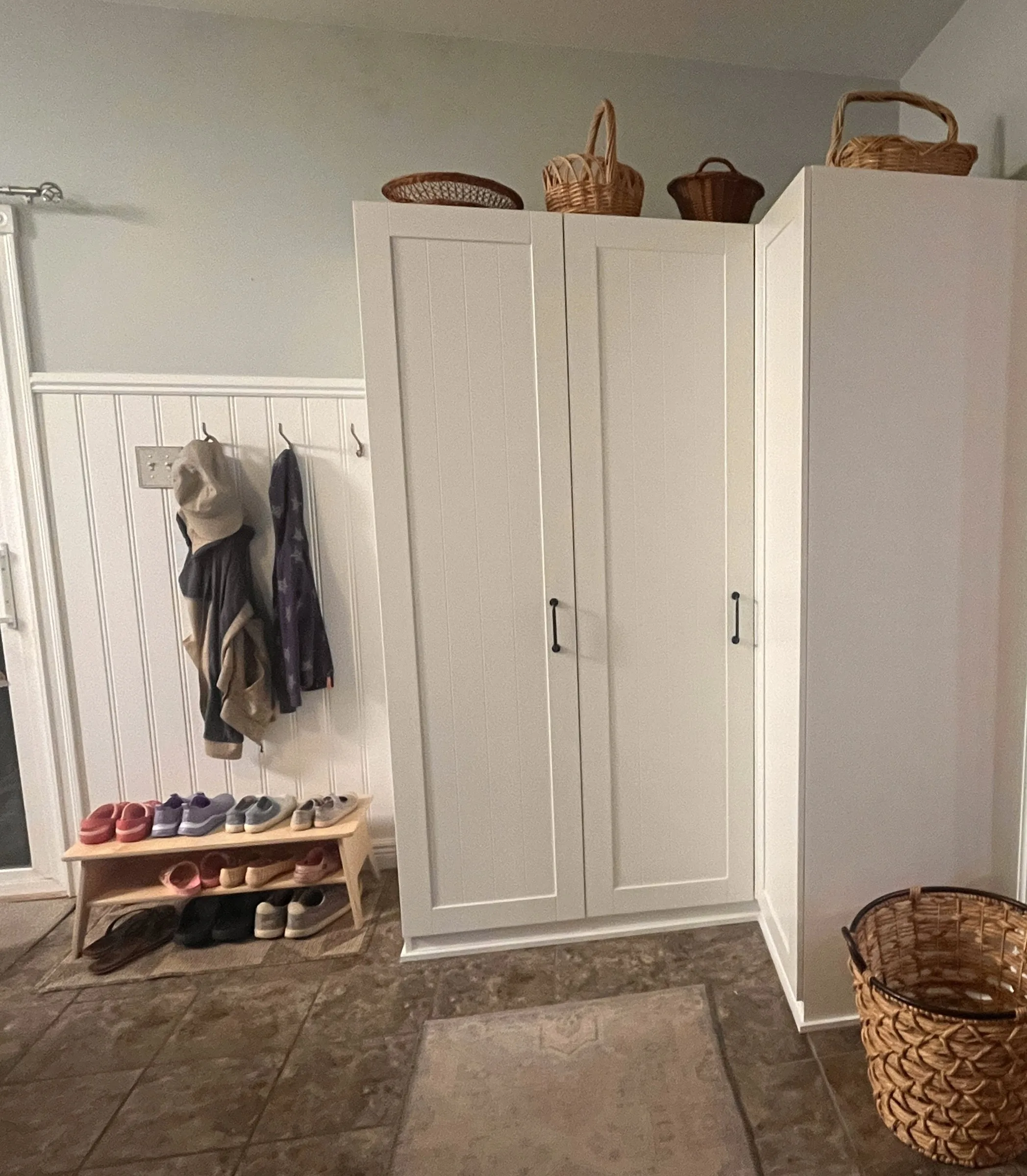 The corner pair seen from the entry, showing how the two cabinets turn the room