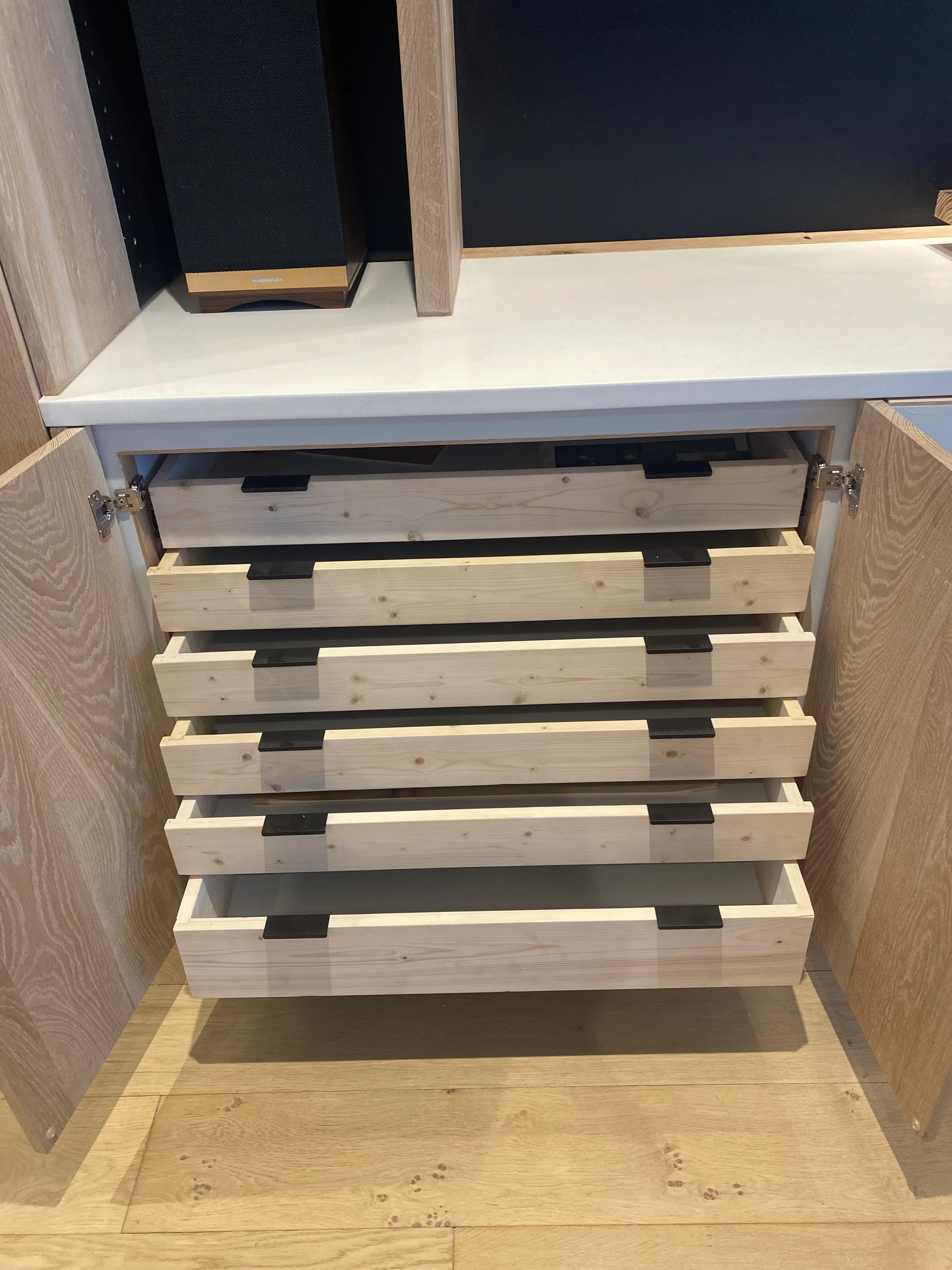 Five-drawer cabinet open inside the oak case